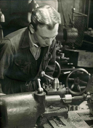 1950 Student learning to operate a lathe.
