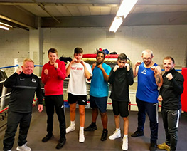 group standing in line in boxing ring