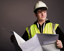 Person with large document and high-visibility jacket